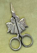 Kelmscottsilverneedleminder.jpg