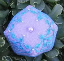 Cross stitch piece embellished with pearl glass beads