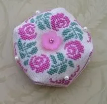 Pearl bead accents on a needlework project